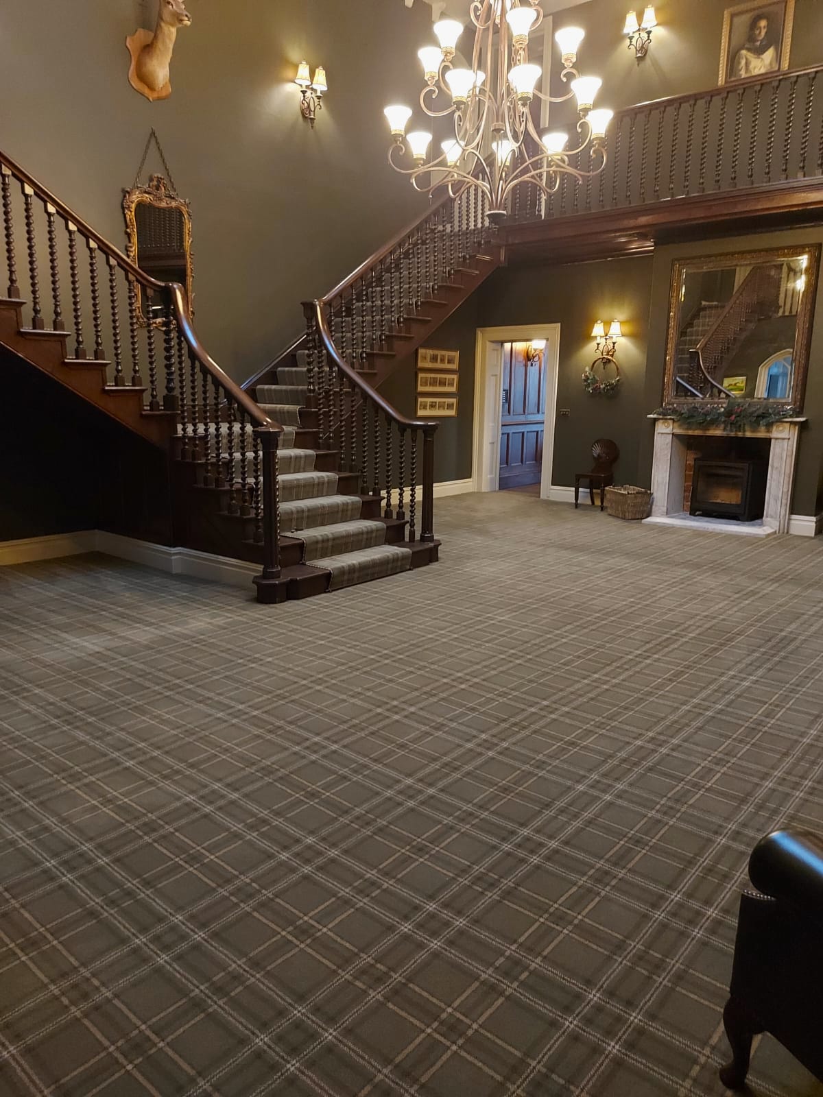 Wide-angle shot of a beautiful staircase in Brintons Abbey Glen Axminster
