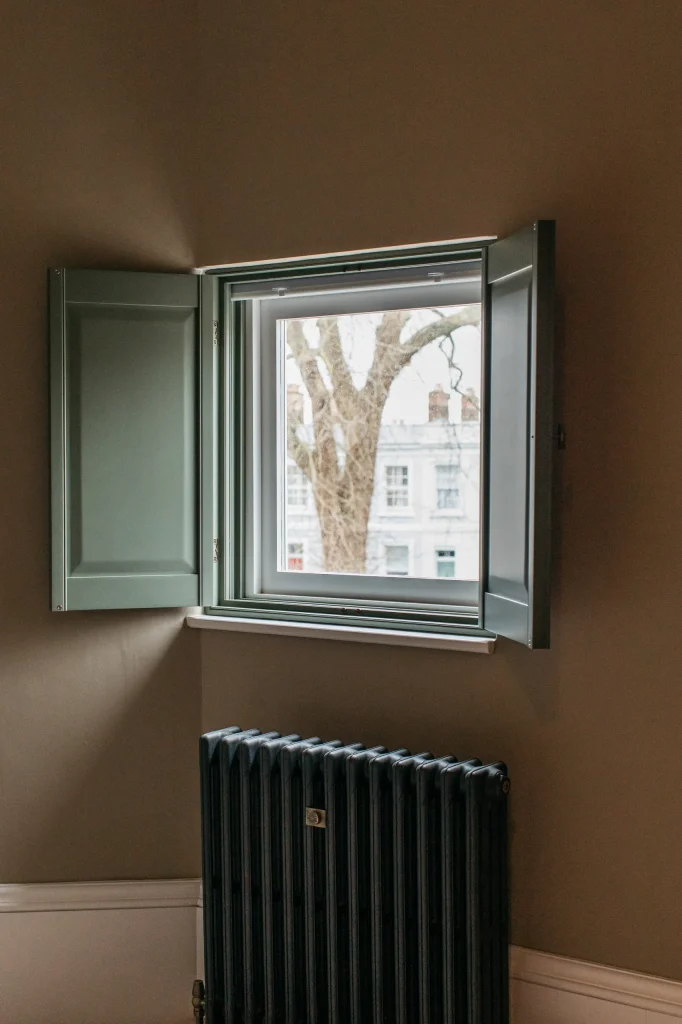 Solid raised blinds and open panel shutters
