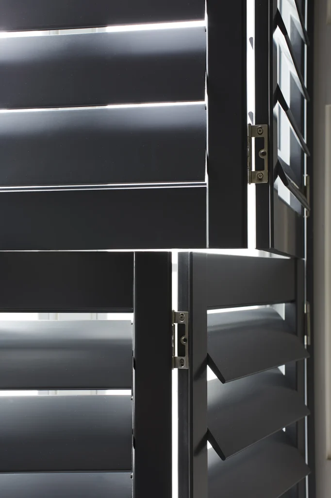 Tier on tier shutters, black, close-up